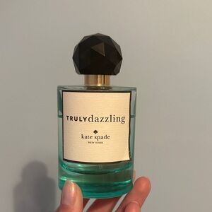 Kate Spade Truly Dazzling Perfume with Black Cap and Teal Hue